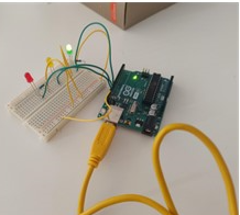 Arduino board with green and yellow cable connections