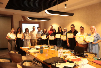 Workshop participants with their certificates